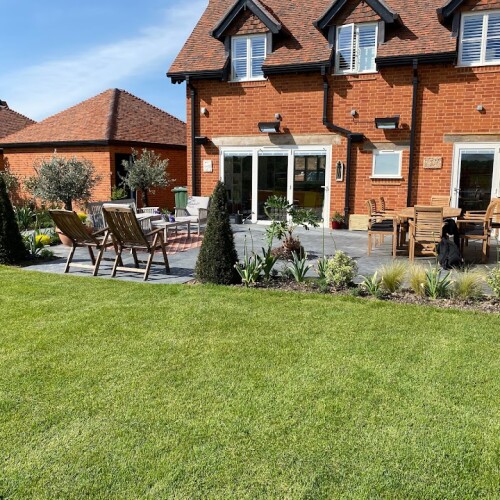 lawn and patio at the back of house